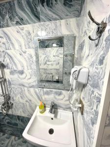 a bathroom with a sink and a mirror at Gabala Luxury Nature Villa in Gabala +12 photos