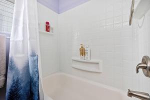 a white bathroom with a tub and a shower at The Brick House, Kellogg ID in Kellogg +40 photos