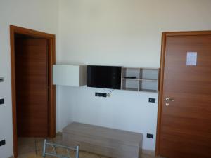 TV i/ili multimedijalni sistem u objektu Residence Doral