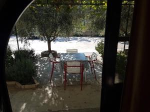 a table and chairs sitting on a patio at Vila Stanisic in Čanj