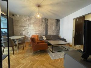 a living room with a couch and a table at Катедрала Варна in Varna City