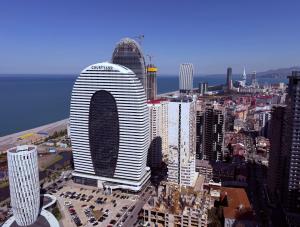a view of a large city with tall buildings at Sun Set Apartments in Batumi