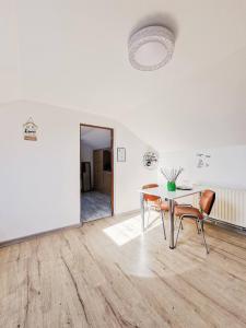 a dining room with a glass table and chairs at Perfekte Rast in Sibiu +16 photos