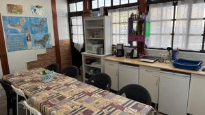 a kitchen with a table and a counter with a table and chairs at 7 Calcosas in Valverde +13 photos