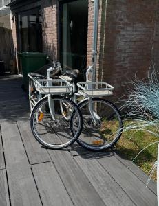 two bikes parked in front of a building at Finch guesthouse in Zandvoort