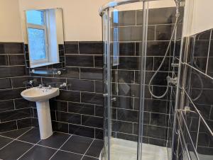 a bathroom with a sink and a shower at Affleck Street in Gateshead +18 photos
