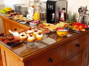 a counter top with many different types of food on it at Balcony House in Galway