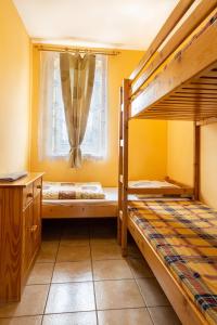 a bedroom with two bunk beds and a window at Vila Horal in Liptovský Mikuláš +66 photos