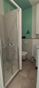 a bathroom with a shower and a toilet at Logement 2 - proche Le Mans in Aigné