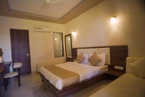 a bedroom with a large bed in a room at Rani Palace Hotel And Resort in Kishangarh