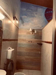a bathroom with a painting on the ceiling at Pousada Aguas Marinhas in Cabo de Santo Agostinho +47 photos