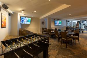 a room with a table and a large board game at Windermere House in Windermere