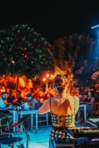 a woman standing in front of a concert at Diplomat Suites in Marmaris +105 photos