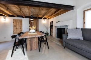 a living room with a table and a couch at Al Crotto in Chiavenna