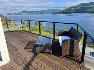 a balcony with a view of the water at Large house with panoramic sea view in Bergen