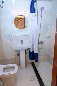a bathroom with a sink and a toilet and a shower at Al Khaima Hotel in Dubai +39 photos