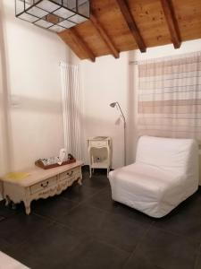 a bedroom with a bed and a table and a lamp at Masoe des Chatards in Neuilly-le-Réal