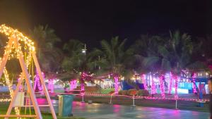 a park with christmas lights and a roller coaster at Okay Marina Lumut Homestay in Lumut