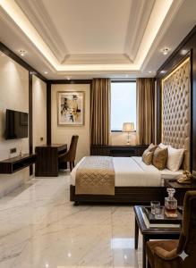 a hotel room with a bed and a desk at Hotel Krone International in Gurgaon