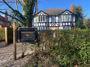 a sign in front of a mansion house at Marton Lodge in Bridlington