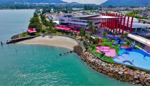 an aerial view of a resort on a beach at Okay Marina Lumut Homestay in Lumut