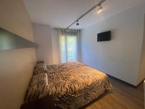 a bedroom with a bed and a television in it at Hotel 9 Sant Antoni Only Adults in Ribes de Freser +38 photos