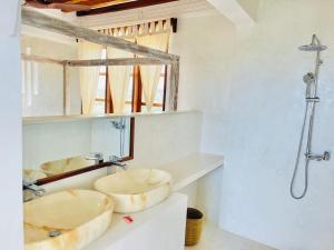 a bathroom with two sinks and a shower at Kilele-Retreat Suite in Shela
