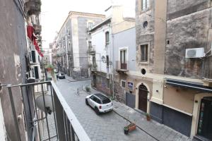 a car parked on a street in a city at Premiere Luxury Catania in Catania