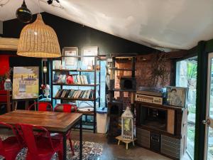 a living room with a table and a fireplace at 好和院景田旅 How Has in Chishang