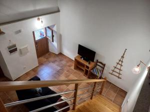 an overhead view of a living room with a television at Casa da Ti Joana in Aranhas