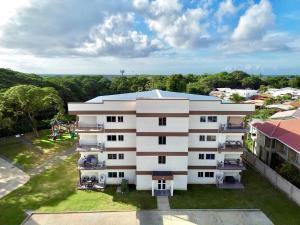 an aerial view of a building with a playground at The Gatehouse Tobago in Buccoo