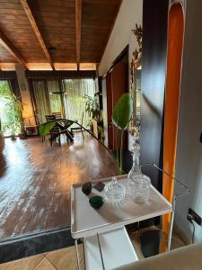 a living room with a table with a vase on it at Casagiardino Sofía in Marina di Varcaturo +33 photos