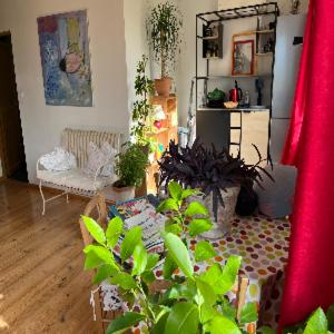 a living room with a couch and a table at À l'ombre du mûrier in Blauvac +17 photos