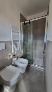 a bathroom with a toilet and a sink and a shower at La Perla del Boccaccio in Certaldo