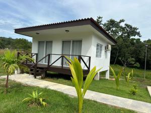 a small white house with a porch at Villa Rio Grande in Santa Catalina