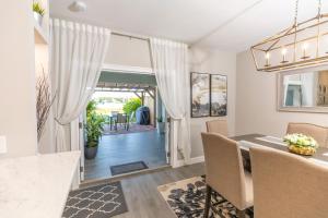 a kitchen and dining room with a table and chairs at Lake Marlin Villa 2 in Port Charlotte