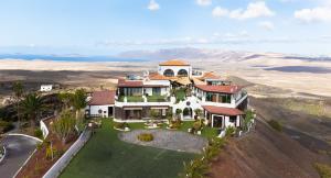 an aerial view of a house in the desert at Casona de Tao in Tiagua