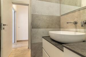a bathroom with a white sink on a counter at Giò Apartment on the beach front - mytouristhome in Portovenere +27 photos