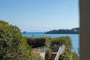 a view of the ocean from a house at Giò Apartment on the beach front - mytouristhome in Portovenere
