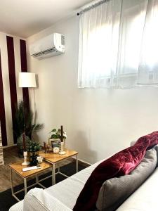 a bedroom with a bed and a table and a window at The Attic in Civitavecchia