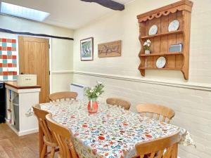 a dining room with a table and chairs at Brook House 2 - Uk31043 in Bassenthwaite