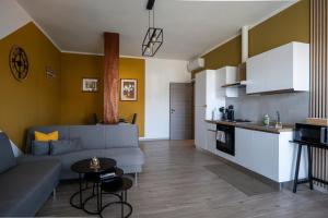 a living room with a couch and a table at Casa Vacanze Aria 1 in Leggiuno