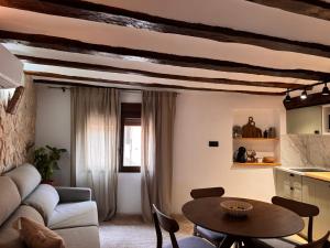 a living room with a couch and a table at La Rambla in Albarracín