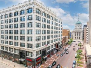 a large white building with a street in front at Historic 2BR stay with patio & elevator in Indianapolis +43 photos