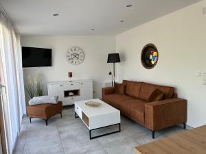 a living room with a couch and a table at Windrose in Korswandt