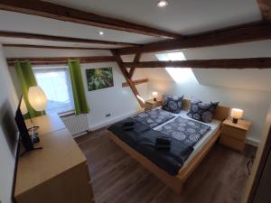 an overhead view of a bedroom with a bed at Apartment Elli in Lichtenhain +43 photos
