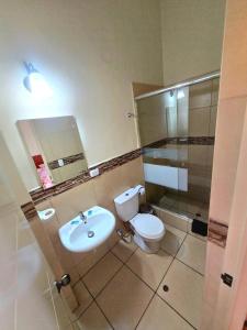 a bathroom with a toilet and a sink and a shower at Santa Marta Casona in Arequipa +38 photos
