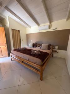 a bedroom with a large bed in a room at B&B Le Villette Las Lajas in Las Lajas