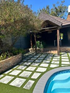 a backyard with a swimming pool and a house at Entire house perfect for group trips and families in Cape Town in Cape Town