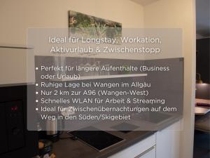 a sign on a wall with a painting at Serviced Apartments, Selbst-Check-in in Amtzell